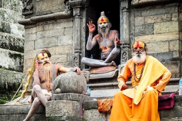 three monks sitting on concrete temple during daytime